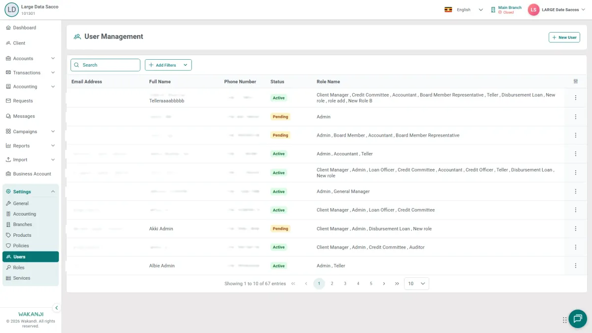 The User Management screen under Settings, listing each admin's details and status, with the New User button