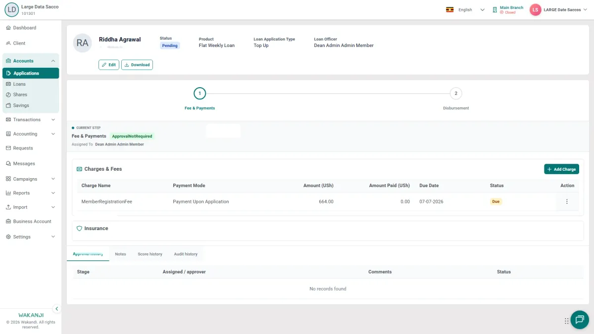 An open loan application: the member and status header at the top, the numbered workflow stages across the screen, and the loan and member detail panels you read before you decide